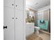 Bright bathroom featuring a vanity with modern fixtures and a tiled walk-in shower with glass door at 7108 Stockholm Way, Orlando, FL 32822