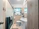 Cozy bathroom with a tiled shower, vanity, and decorative mirror at 7108 Stockholm Way, Orlando, FL 32822
