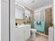 Bright bathroom featuring a vanity with modern fixtures and a tiled walk-in shower with glass door at 7108 Stockholm Way, Orlando, FL 32822