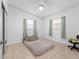 Cozy bedroom with tiled flooring and natural light at 7108 Stockholm Way, Orlando, FL 32822