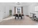 Bright dining room with modern chandelier and large window at 7108 Stockholm Way, Orlando, FL 32822