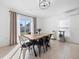 Bright dining room features modern chandelier and sliding glass door at 7108 Stockholm Way, Orlando, FL 32822