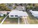 Charming single-story home featuring a covered front porch, lush yard, and long driveway at 7108 Stockholm Way, Orlando, FL 32822