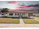 Charming single-story home with a well-maintained lawn and covered front entrance at 7108 Stockholm Way, Orlando, FL 32822