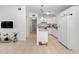Spacious kitchen featuring white cabinets, granite countertops, and tiled flooring at 7108 Stockholm Way, Orlando, FL 32822