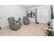 Inviting living room showcasing tile flooring, neutral walls, and comfortable seating near a bright window at 7108 Stockholm Way, Orlando, FL 32822