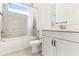 Bright bathroom with shower-tub combination, stylish tile, and white vanity at 8006 Hoylake Dr, Orlando, FL 32832