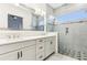 Bathroom with double sinks, glass shower, and modern fixtures at 8006 Hoylake Dr, Orlando, FL 32832