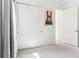 Bedroom featuring double closets, a large art piece, neutral carpet, and lots of natural light at 8006 Hoylake Dr, Orlando, FL 32832