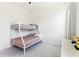 Bright bedroom featuring a bunk bed, plush carpet, and plenty of natural light at 8006 Hoylake Dr, Orlando, FL 32832