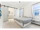 Bright bedroom with sliding barn doors to the ensuite bathroom, neutral color palette, and ample natural light at 8006 Hoylake Dr, Orlando, FL 32832