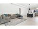 Bright and spacious living room connected to the dining area, perfect for entertaining at 8006 Hoylake Dr, Orlando, FL 32832