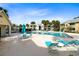 Relaxing community pool area features lounge chairs, tables, and umbrellas for shade at 1017 S Hiawassee Rd # 3718, Orlando, FL 32835