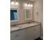 Bathroom featuring granite countertops, double sinks, and modern fixtures at 120 S Chandler Ave, Deland, FL 32724