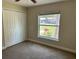 This bedroom is nice and cozy and offers plenty of light from the window at 120 S Chandler Ave, Deland, FL 32724