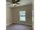 Bright bedroom with a window showcasing the outdoor scenery at 120 S Chandler Ave, Deland, FL 32724
