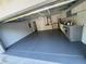 This garage features a high ceiling and speckled floor. Great for storage at 120 S Chandler Ave, Deland, FL 32724