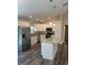 Eat in kitchen features granite countertops, stainless steel appliances, and white cabinets at 120 S Chandler Ave, Deland, FL 32724