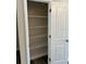 Pantry with a door, featuring ample white wire shelving for organized storage at 120 S Chandler Ave, Deland, FL 32724