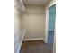 Walk-in closet with carpet flooring and wire shelving at 120 S Chandler Ave, Deland, FL 32724