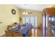 Dining room featuring a large table, chandelier, and a display cabinet at 130 Hillside Dr, Davenport, FL 33897