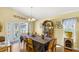 Dining room with a long table, display cabinet, and decorative touches at 130 Hillside Dr, Davenport, FL 33897