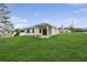 Home's backyard, a lush green space ideal for outdoor activities and relaxation at 13405 Sw 88Th Ter # 53, Ocala, FL 34473