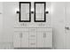 Bright bathroom with double vanity, framed mirrors, and white marble flooring at 13405 Sw 88Th Ter # 53, Ocala, FL 34473