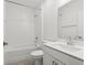 Clean bathroom with a vanity, toilet, tub, and shower, offering modern fixtures and style at 13405 Sw 88Th Ter # 53, Ocala, FL 34473