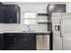 Kitchen with stainless steel appliances, dark cabinets, and countertops, a culinary delight at 13405 Sw 88Th Ter # 53, Ocala, FL 34473