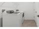 Laundry room complete with a washer, dryer, and tile floor, providing convenience at 13405 Sw 88Th Ter # 53, Ocala, FL 34473