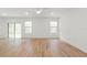 Spacious, bright living room with stylish flooring and ample natural light from the windows at 13405 Sw 88Th Ter # 53, Ocala, FL 34473