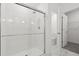 Glass enclosed shower with white subway tile and rainfall shower head at 13405 Sw 88Th Ter # 53, Ocala, FL 34473