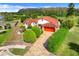 An elevated view of the lovely home showcasing manicured landscaping and expansive backyard at 13542 Texas Woods Cir, Orlando, FL 32824