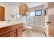 Bathroom featuring a tub-shower and single vanity sink at 13542 Texas Woods Cir, Orlando, FL 32824