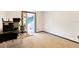 Bedroom with neutral carpet, a desk, and doorway to a screened-in patio at 13542 Texas Woods Cir, Orlando, FL 32824