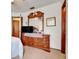 Bedroom with built in dresser and adjacent bathroom at 13542 Texas Woods Cir, Orlando, FL 32824