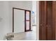 Bright entryway featuring a white front door with decorative stained glass side panel and marble floors at 13542 Texas Woods Cir, Orlando, FL 32824