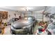 This garage has an open overhead door and a gray car parked inside at 13542 Texas Woods Cir, Orlando, FL 32824