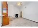 Spacious living room featuring tile floors, a ceiling fan, and plenty of natural light at 13542 Texas Woods Cir, Orlando, FL 32824