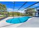 This pool has a screened in patio and a lovely view at 13542 Texas Woods Cir, Orlando, FL 32824