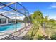 Screened in pool with a beautiful side yard at 13542 Texas Woods Cir, Orlando, FL 32824