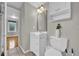 Bright bathroom featuring a modern vanity, toilet, and tiled flooring with an ensuite entrance at 1407 Lantry Ct, Orlando, FL 32804