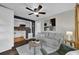 Comfortable living room showcasing view of the kitchen, contemporary decor, and a ceiling fan at 1407 Lantry Ct, Orlando, FL 32804