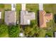 Bird's-eye view showcases a home with a neutral roof, surrounded by well-maintained lawns and neighboring houses at 142 Barrington Dr, Kissimmee, FL 34758