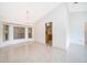 Bright dining area showcasing tile floors and large windows at 142 Barrington Dr, Kissimmee, FL 34758