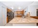 Traditional kitchen featuring stainless steel appliances, tile countertops, and wood cabinets at 142 Barrington Dr, Kissimmee, FL 34758