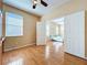 Bedroom with wood floors connecting to the main bedroom through an open door at 14228 Portrush Dr, Orlando, FL 32828