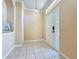 Bright foyer features tile flooring, front door with glass block window, and neutral walls at 14228 Portrush Dr, Orlando, FL 32828