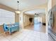 Dining area and kitchen with access to a living area; stainless steel fridge and modern dining furniture at 14228 Portrush Dr, Orlando, FL 32828